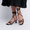 Sandalias con tacón de piel con tiras trenzadas para mujer negro Gabriella