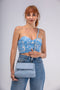 Bolso bandolera con solapa de piel azul celeste Carla primavera